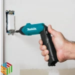 Makita DF001DW cordless screwdriver on project screwing wall