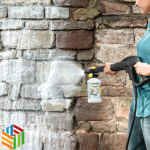 Person cleaning a wall with Karcher FJ 10 C Foam Nozzle and Advanced Stone Cleaner