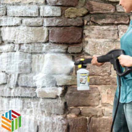 Person cleaning a wall with Karcher FJ 10 C Foam Nozzle and Advanced Stone Cleaner